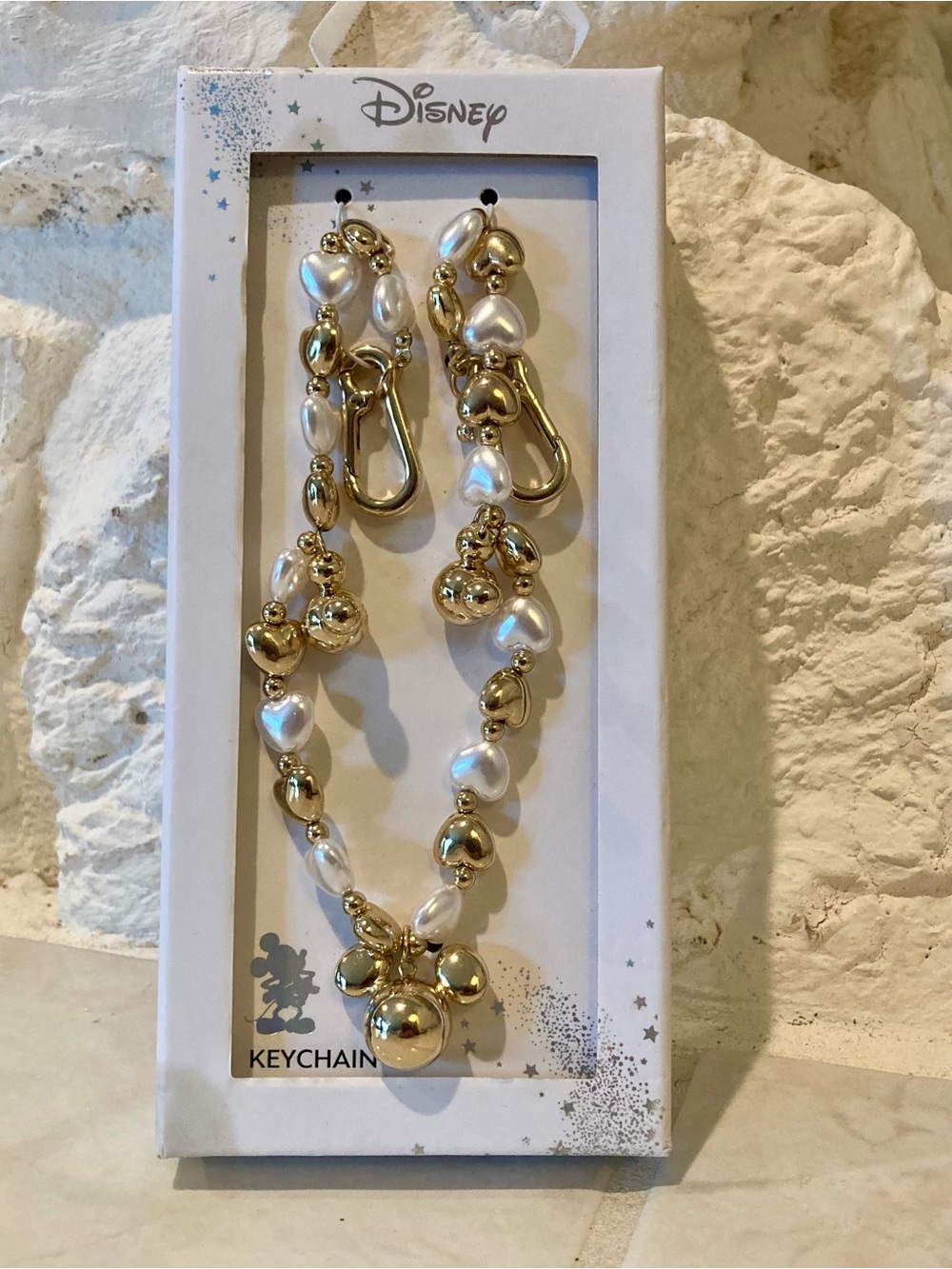 NWT and box Disney faux pearl and gold bag charm and key chain